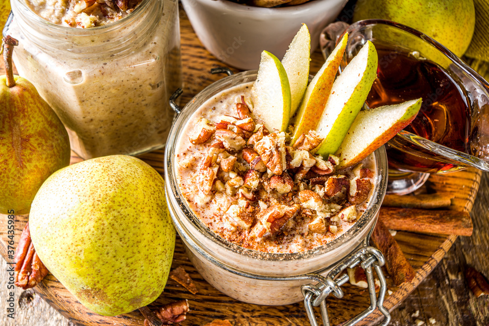 Wall mural sweet and spicy autumn breakfast oats recipe, homemade pear and cinnamon overnight oatmeal with spic