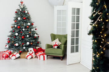 Blue Christmas tree with red gifts decor garland for the new year winter in the white holiday card room