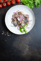 herring salad onion dressing snack seafood fish serving size natural top view place for text copy space keto or paleo diet raw pescetarian