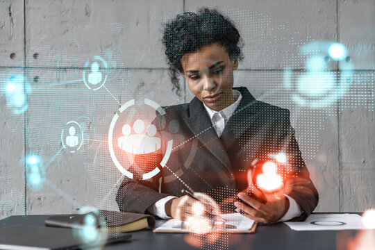Businesswoman taking notes and social media icons hologram. Double exposure. Technology security network solution concept.