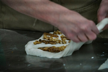 Baker preparing walnut bread