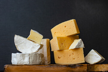 cheese assortment different types of hard and soft cheeses serving size raw natural milk top view copy space for text