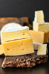 cheese assortment different types of hard and soft cheeses serving size raw natural milk top view copy space for text