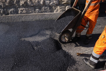 Paving the road with porous asphalt for traffic noise.reduction in Geneva, switzerland