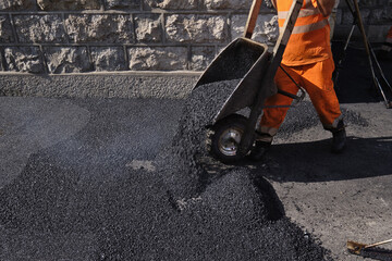 Paving the road with porous asphalt for traffic noise.reduction in Geneva, switzerland