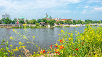 Fototapeta na wymiar Panoramic view over beach cafes, restaurants and camping site for campers at the downtown near Elbe river in Magdeburg, Germany