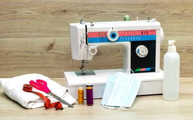 Designer work place sewing machine and medical mask, gel in office