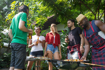 Naklejka na ściany i meble Group of friends having fun and happy in barbecue party at house backyard