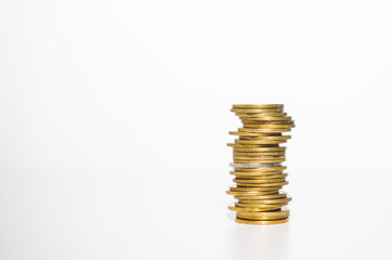 golden coin stack row growing pile on white background for money saving and investment business financial and banking concept.