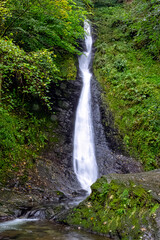 Fototapeta na wymiar Whitelady waterfall in rain - Lydford, Dartmoor National Park, Devon, United Kingdom