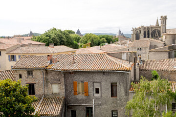 Fototapeta na wymiar The roofs of historic downtown of Carcassone, France and the medieval castle - Cité de Carcassonne