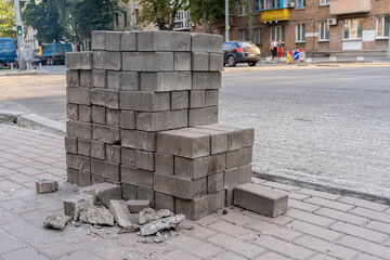 Obraz premium Pallets with folded paving slabs. vertically folded street tiles.