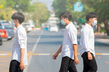 Group of Young man wearing a mask on the street. Protection against covid19, flu, pollution, contagious diseases.