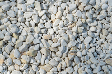 Background from many white stones, pebbles close up