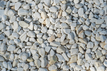 Background from many white stones, pebbles close up