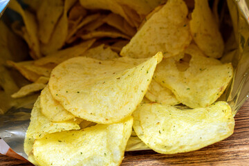 yellow potato chips in a packet close up