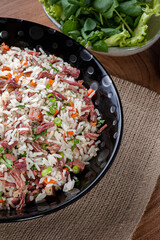 Arroz de Carreteiro - Typical food from southern Brazil, made with rice, dried meat, pepperoni sausage, bacon and carrots. Top view