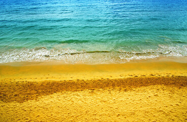 Aerial view of transparent turquoise sea and beach