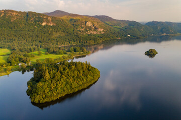 Aerial view of a large, beautiful lake with islands at sunset (Derwent Water, Lake District, England)