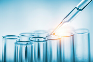 Closeup of Scientists use a chemical dropper into a test tube during an experiment in a science...