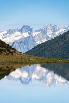 Piz Badile and Cengalo reflected in Porcile Lakes, Val Lunga, Tartano Valley, Valtellina, Sondrio province, Lombardy