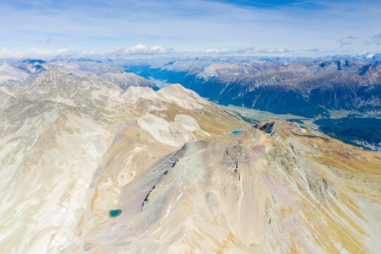 Aerial panoramic by drone of majestic Piz Nair mountain and lake Lej Da La Pesch, Engadine, canton of Graubunden, Switzerland