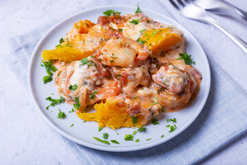 Pumpkin with shrimps and cheese. Traditional Brazilian dish. Close-up.