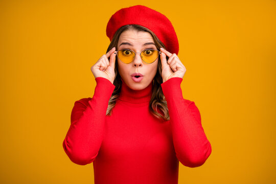 Close-up portrait of her she nice-looking attractive pretty fashionable cheery amazed wavy-haired girl touching specs incredible new sale isolated on bright vivid shine vibrant yellow color background