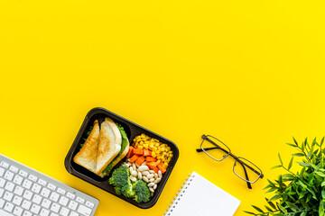 Food delivery to office. Business lunch in take away box, top view