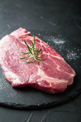 Fresh marbled beef steak on dark background
