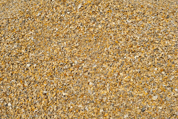 Drainage systems from small pebbles. Garden drainage for plants and trees. Yellow stones for roads and flower beds.