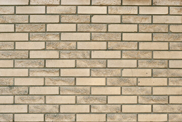 Obraz premium Texture of brick wall. new brickwork. Samples of wall or fence are presented at exhibitions. Yellow brick close up.