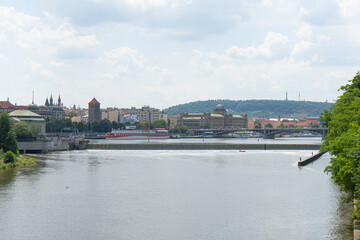 Fototapeta premium view of the flowing Vltava river in the center of Prague during the day