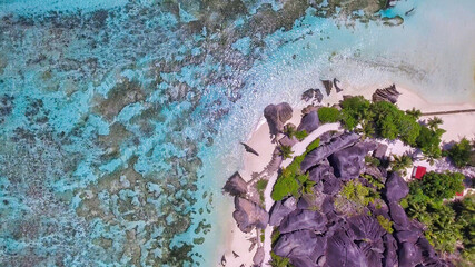 Overhead aerial view of Anse Source Argent in La Digue, Seychelles from drone