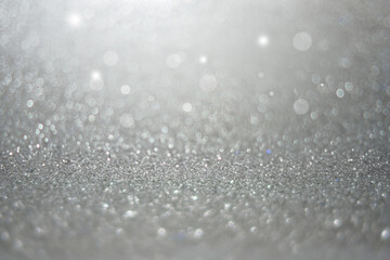 Grey or Gray abstract glitter background of shiny snowflakes for Christmas and Valentine. 