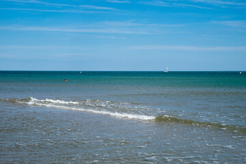 The beautiful seascape - the magnificent view of the seashore, coast of the Mediterranean sea and the lonely beach with wooden cottage in the seaside resort of Gruissan, France