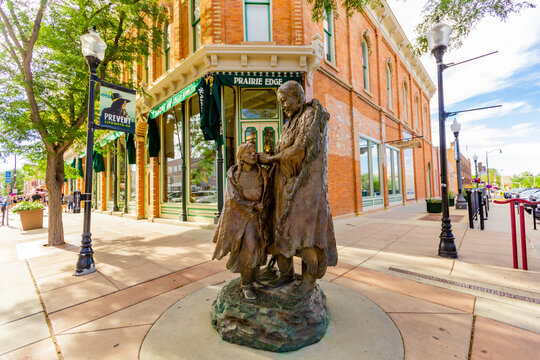 A statue of a Sioux Native American woman and her daughter in downtown Rapid City, South Dakota