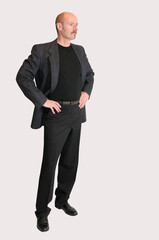 Cutout of man in jacket standing with arms akimbo