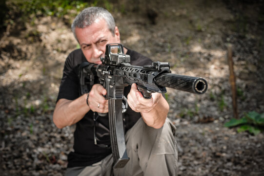 Front view gun point of rifle machine gun. Firearm shooting and tactical weapons training. Outdoor shooting range