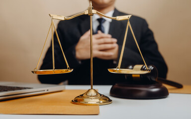 Business and lawyers discussing contract papers with brass scale on desk in office. Law, legal...