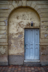 Fototapeta na wymiar Blue Door Yellow Wall Archway