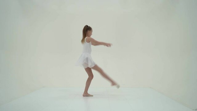 Graceful Girl Gymnast Performing Rhythmic Gymnastics Exercise.