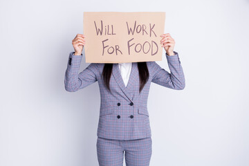 Will work for food. Photo of worker dismissed lady suffer financial crisis lost work job hold placard search ready work food exchange hide face wear suit isolated grey color background