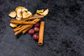 
Dried fruits on a dark abstract background with place for text on the right side.