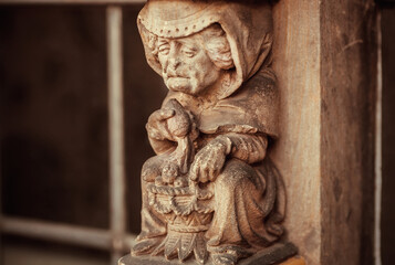 Older market seller sculpture on wall of the15th century Rathaus building. Bremen.