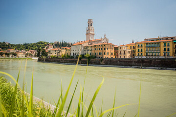 Fototapeta premium View of the Duomo in Verona looking above the Adige river on a sunny day with no clouds.
