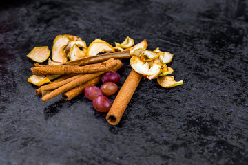 cinnamon sticks on a black background