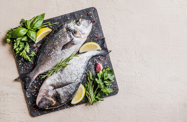 Fresh fish with herbs, dorado fishes copy space.	