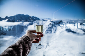 champagne and snowy mountains winter holiday