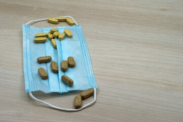 Medical mask and tablets. Medicines and disposable medical mask.